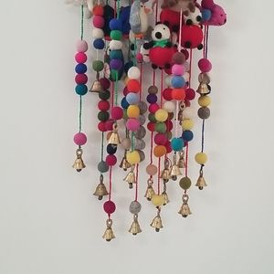 Felted Wool animal and pom pom wall hanging.